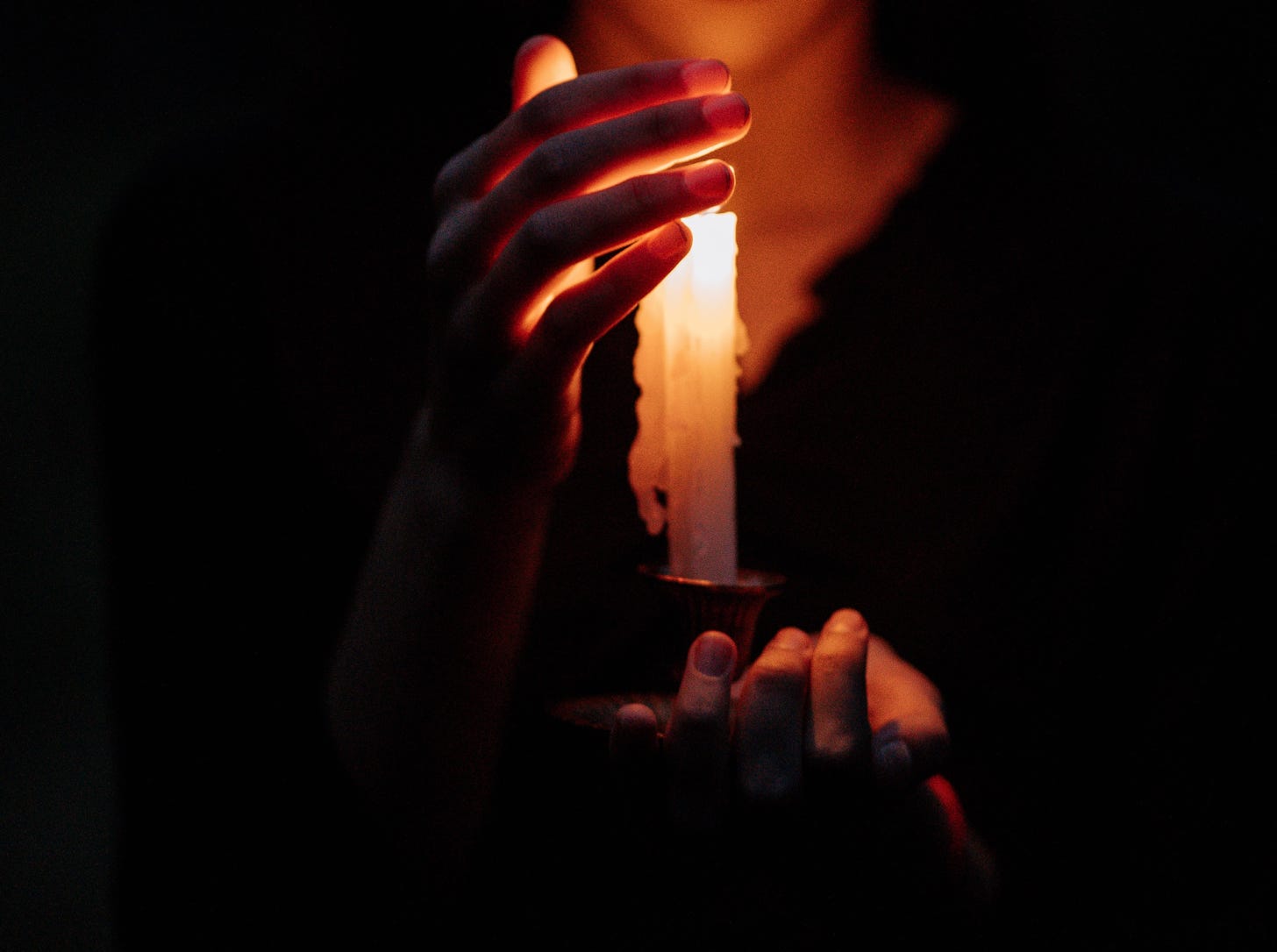 Girl holding candle
